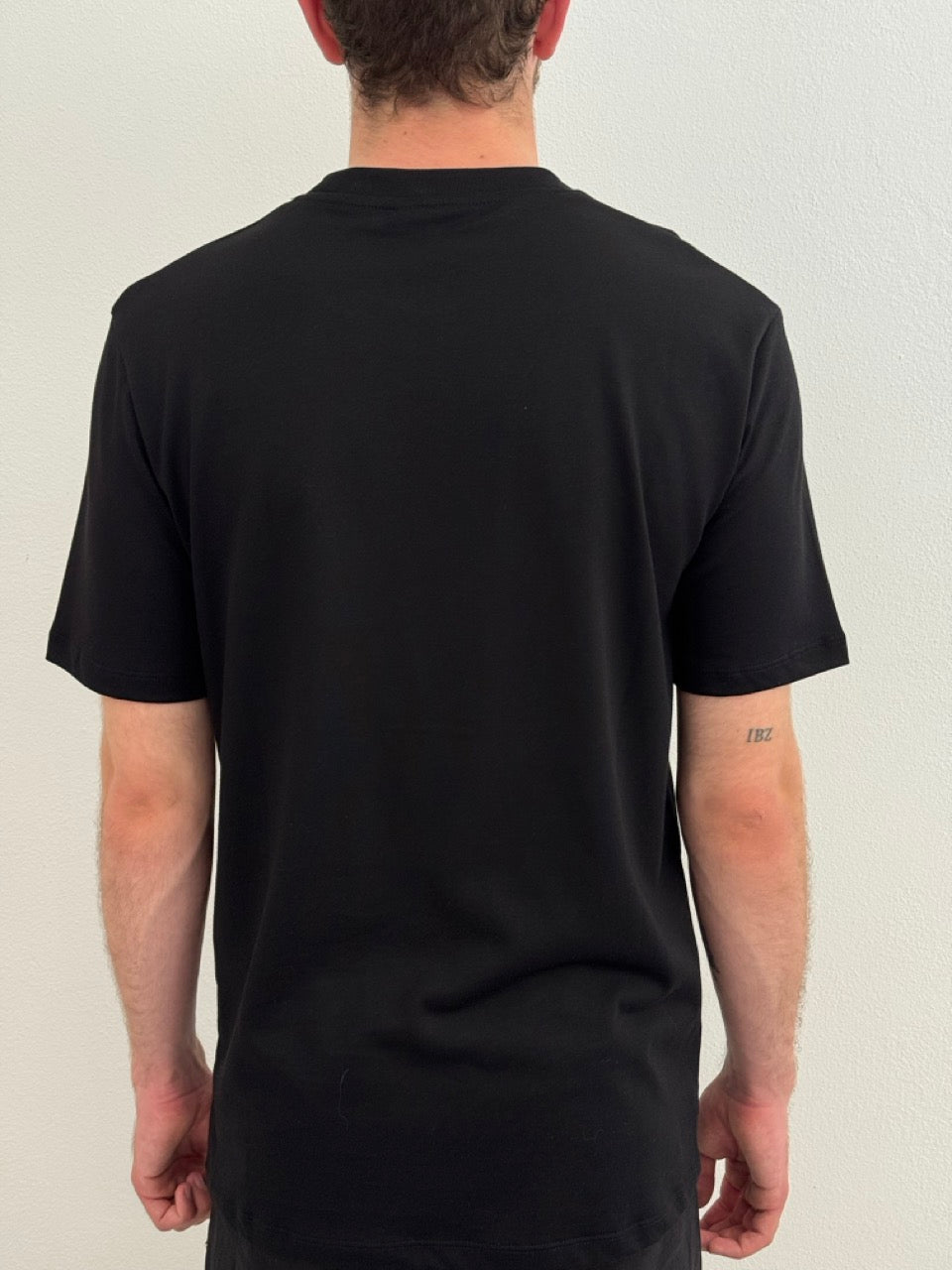 T-shirt in jersey girocollo con etichetta